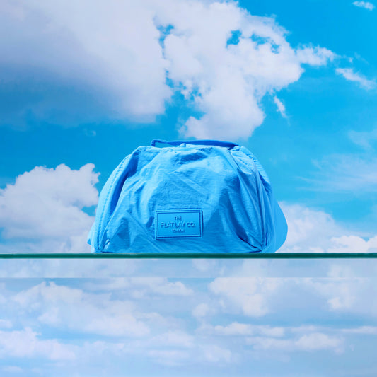 The Flat Lay Co. Drawstring Makeup Bag in Blue Parachute